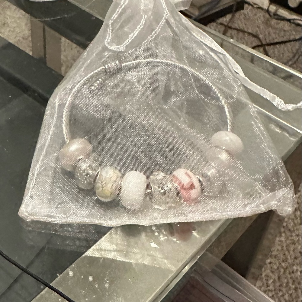 Silver bracelet with charms